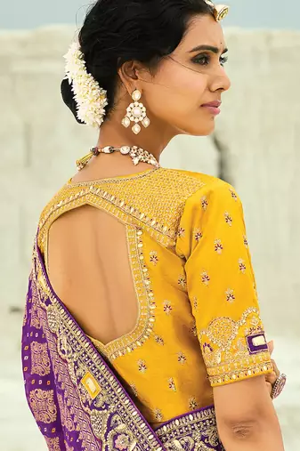 Purple embroidered faux georgette bandhej saree