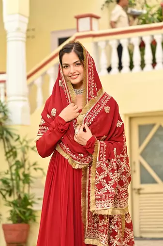 Red faux georgette zari sequins embroidered flared gown with heavy dupatta