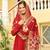 Red faux georgette zari sequins embroidered flared gown with heavy dupatta