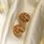 Gold plated temple stud earrings
