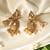 Gold plated temple pearl dangler earrings