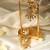 Gold plated temple pearl dangler earrings