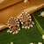 Gold plated temple pearl earrings
