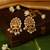 Gold plated temple pearl earrings