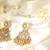Gold plated temple dangler earrings