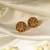 Gold plated temple stud earrings