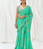 Turquoise floral printed crepe saree