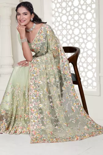 Pista green color resham embroidery & stone work net party wear saree with blouse pieces