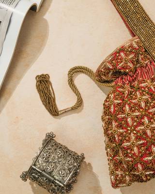 red silk floral embroidered potli bag with beaded handle 3