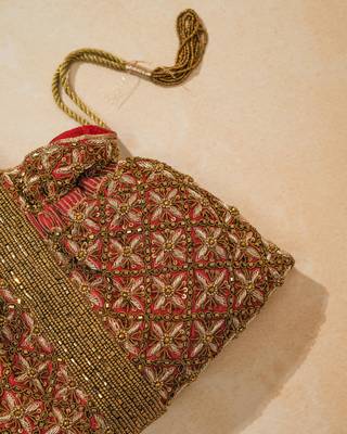 red silk floral embroidered potli bag with beaded handle 4