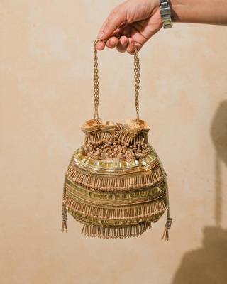 gold silk embroidered ethnic potli bag 1