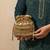 Gold silk embroidered potli bag