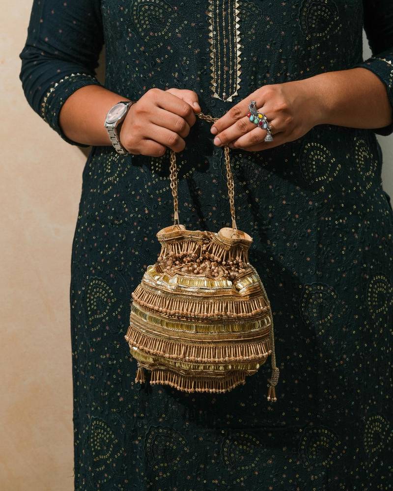 Gold silk embroidered potli bag