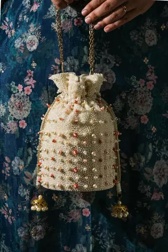 white pearl embroidered silk potli bag for festive wear