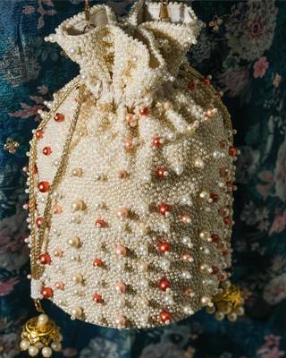 white pearl embroidered silk potli bag for festive wear 3