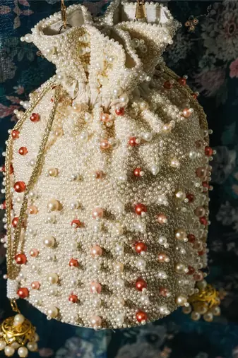 white pearl embroidered silk potli bag for festive wear