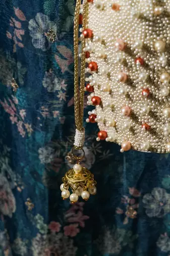 white pearl embroidered silk potli bag for festive wear