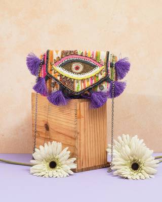 multicolor beads & tassel embellished jacquard sling clutch 1