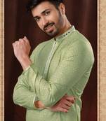 Straight art silk light green solid collar neck with embroidery kurta payjama