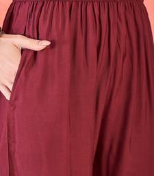 Women's maroon v-neck embroidered kurta with trousers & dupatta