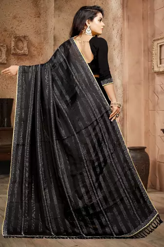 Black color siroski stone work rimzhim patta saree with  blouse