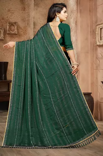 Green color siroski stone work rimzhim patta saree with  blouse
