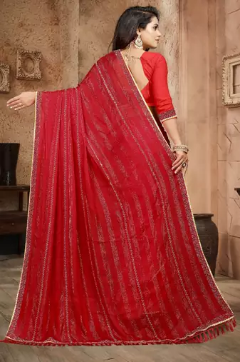 Red color siroski stone work rimzhim patta saree with  blouse