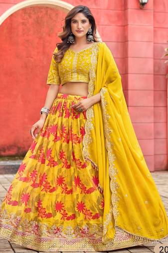 Yellow art silk semi stitched lehenga choli with taby silk print