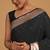 Black color elegant banarasi silk saree with gold zari weaving work comes with unstitched blouse piece