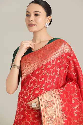 Red color banarasi silk blend saree with gold zari weaving work