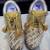 Golden solid synthetic sneakers
