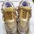 Golden solid synthetic sneakers