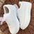 White solid synthetic sneakers