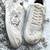 White solid synthetic sneakers