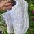 White solid synthetic sneakers