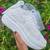 White solid synthetic sneakers