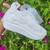 White solid synthetic sneakers