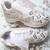 White solid synthetic sneakers