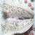 White solid synthetic sneakers