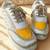 Yellow solid synthetic sneakers