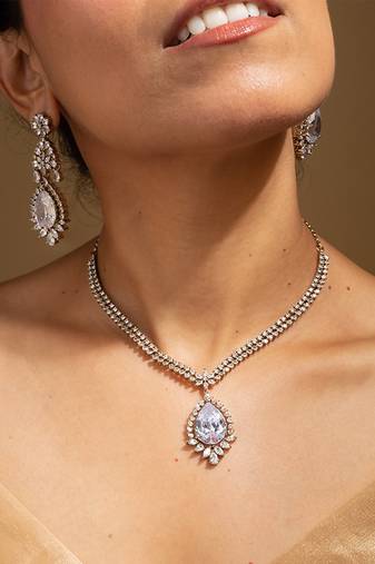 Elegant crystal jewelry set with teardrop pendant and matching earrings