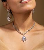 Elegant crystal jewelry set with teardrop pendant and matching earrings