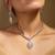Elegant crystal jewelry set with teardrop pendant and matching earrings