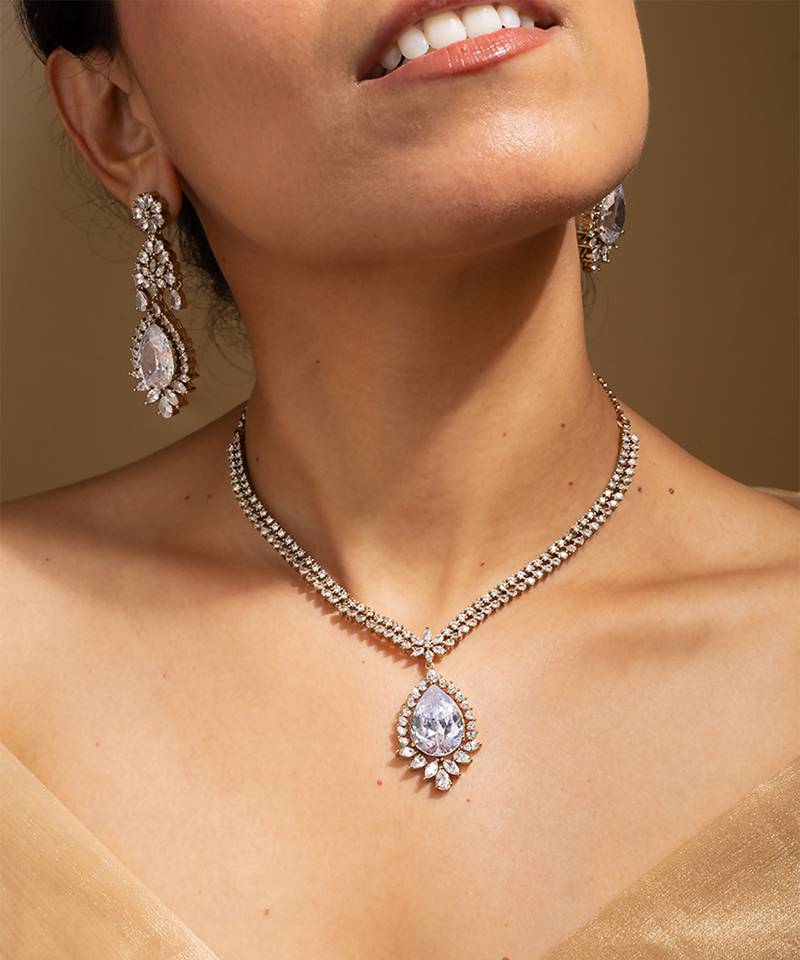 Elegant crystal jewelry set with teardrop pendant and matching earrings