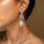 Elegant crystal jewelry set with teardrop pendant and matching earrings