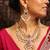Layered kundan necklace set with green stone and pearl drops