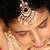 Layered kundan necklace set with green stone and pearl drops