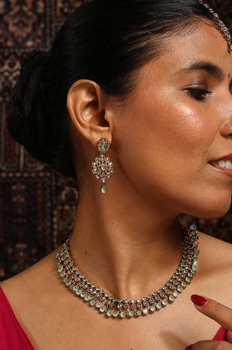 Delicate mint green and gold statement necklace set with matching earrings and tikka