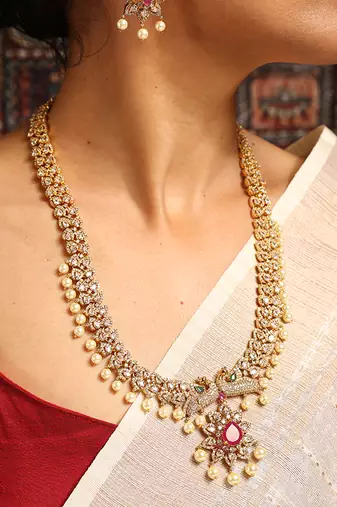 Gold necklace with ruby and pearl accents