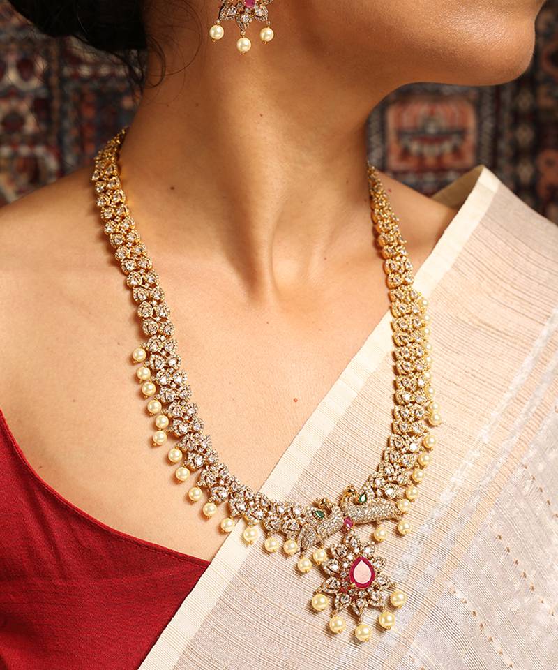 Gold necklace with ruby and pearl accents